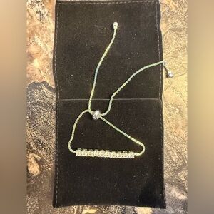 Nine West Silver Adjustable Bracelet with Clear Stones. New in Box.